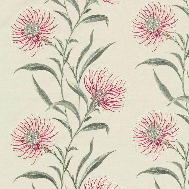 Embroidered fuchsia floral fabric with grey-green stems on a pale ground