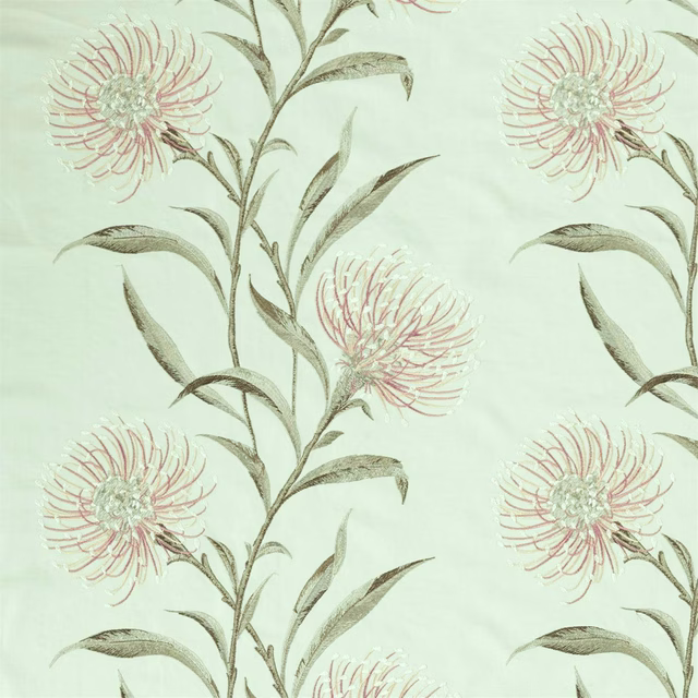Mint green embroidered fabric with blush flower heads and trailing stems