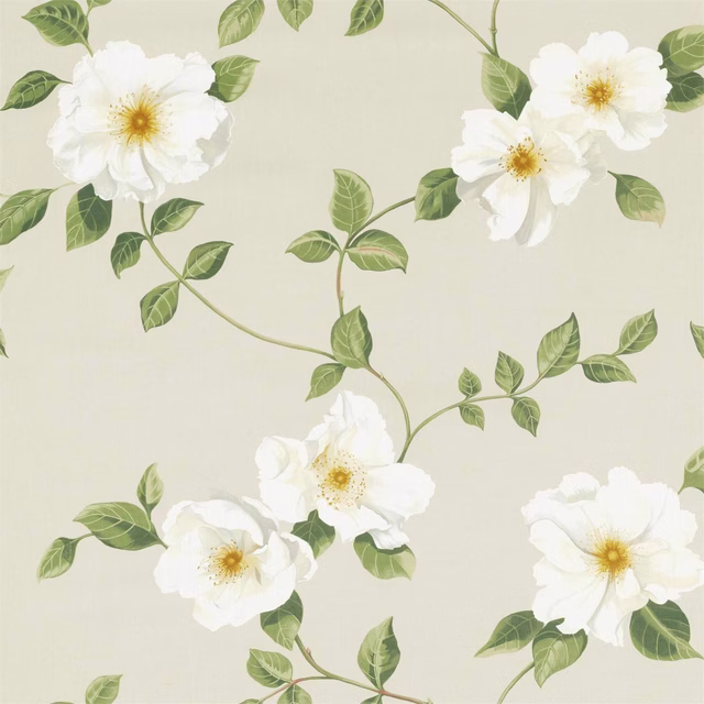 White rose print with green leaves on a soft rose-cream fabric ground
