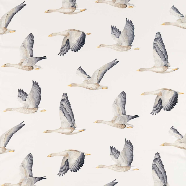 Patterned fabric swatch with flying geese in silver-grey on a chalk-white ground