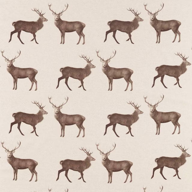 Chalk cream fabric swatch with repeating brown stag motifs