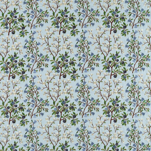 Pale blue botanical fabric with embroidered tree branches, leaves and berries