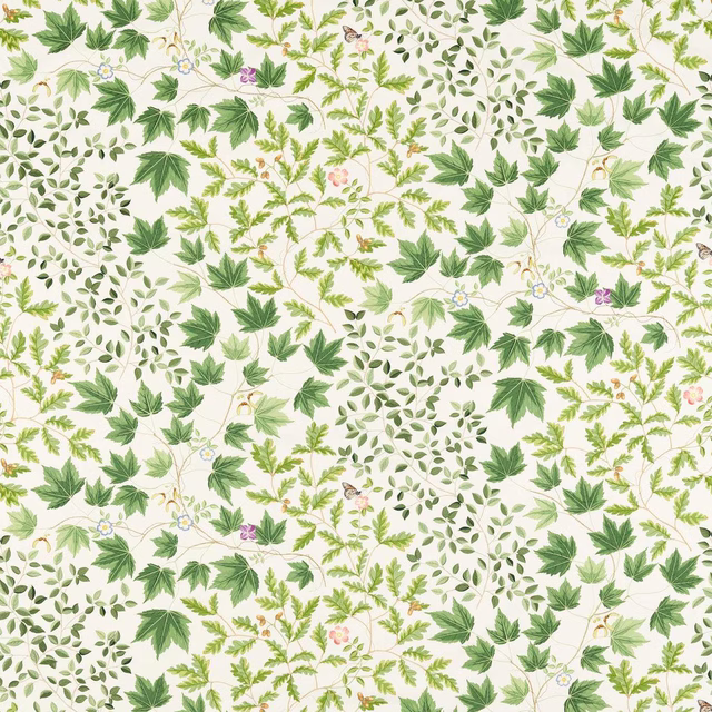 Leafy botanical print in layered greens on a cream ground