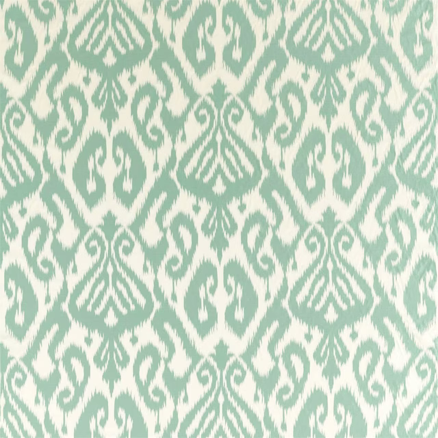 Sea-glass teal and cream ikat-style fabric swatch with large woven-looking motif