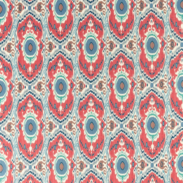 Coral red patterned fabric with midnight blue and teal circular medallions
