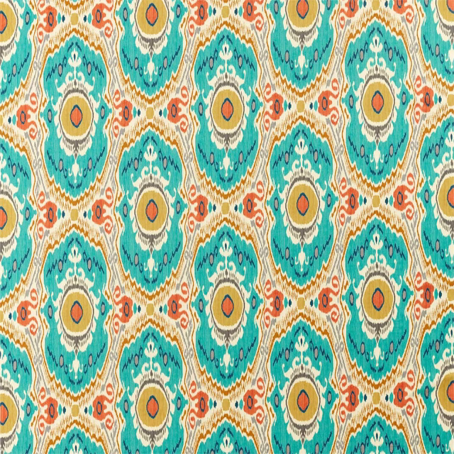 Teal and saffron circular medallion print on a cream fabric swatch