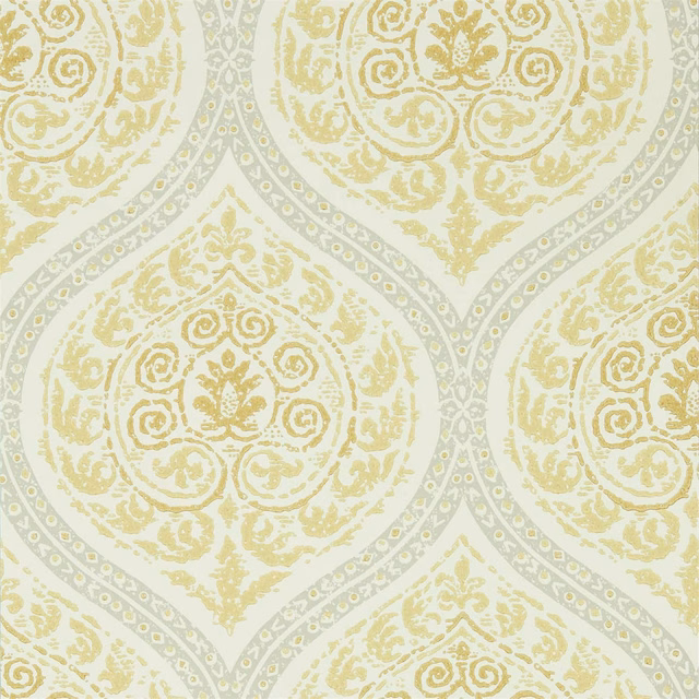 Pale lemon damask wallpaper with grey-blue medallion outlines and distressed floral scrollwork