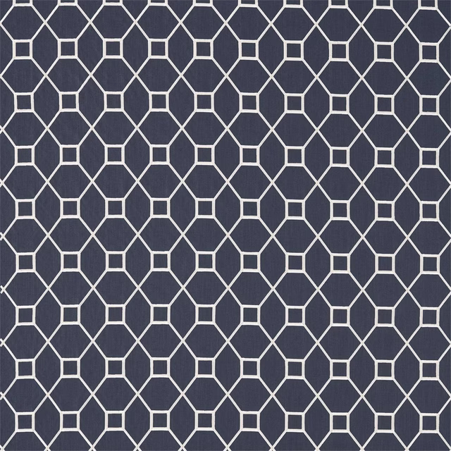 Deep indigo geometric trellis fabric with ivory outlined hexagons and squares