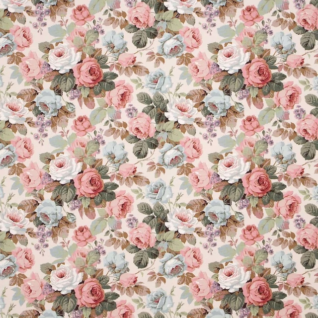 Large floral fabric on an ivory ground with pink, duck egg and sage blooms