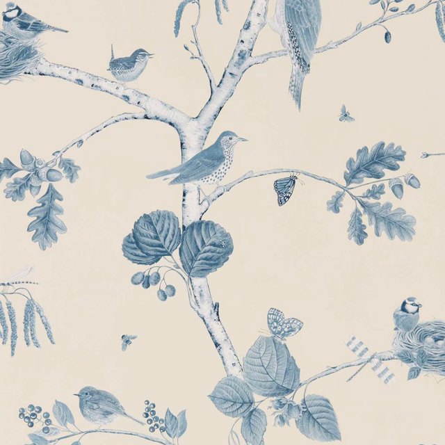 Muted indigo-blue birds and branches on warm ecru woodland wallpaper