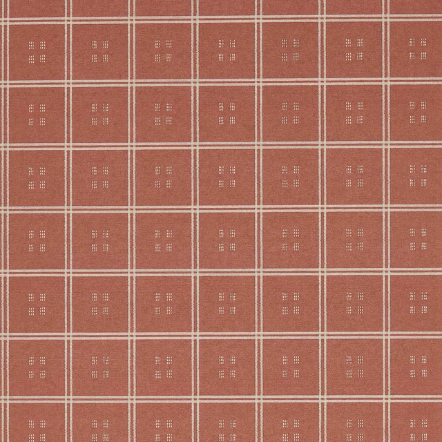 Dusty terracotta wallpaper with cream grid lines and small dotted square motifs