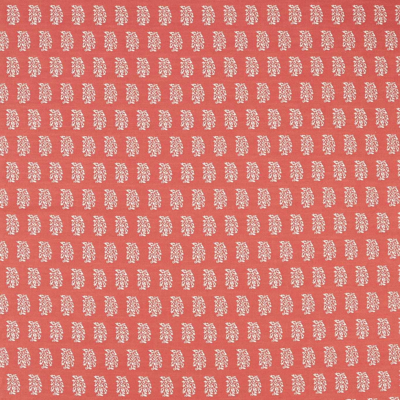 Coral-pink woven fabric with small cream repeating motif