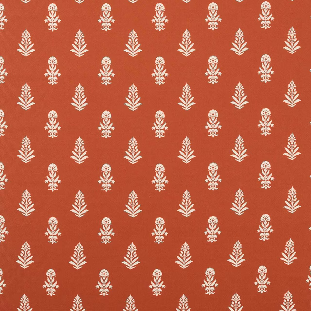 Terracotta woven fabric with small ivory leaf motif repeat