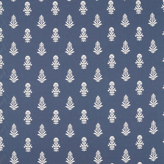 Blue woven fabric with small ivory damask-style motifs on a muted indigo ground