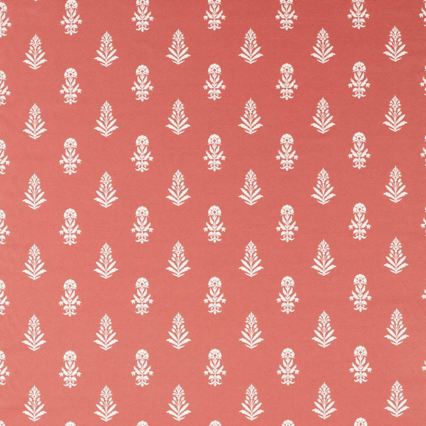 Coral terracotta fabric with small white repeating leaf motifs