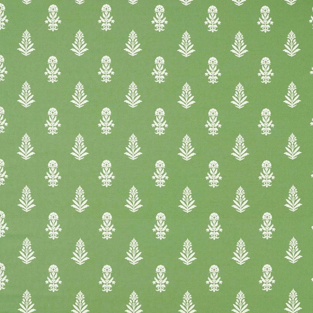 Fresh green woven fabric with small white repeating leaf motifs
