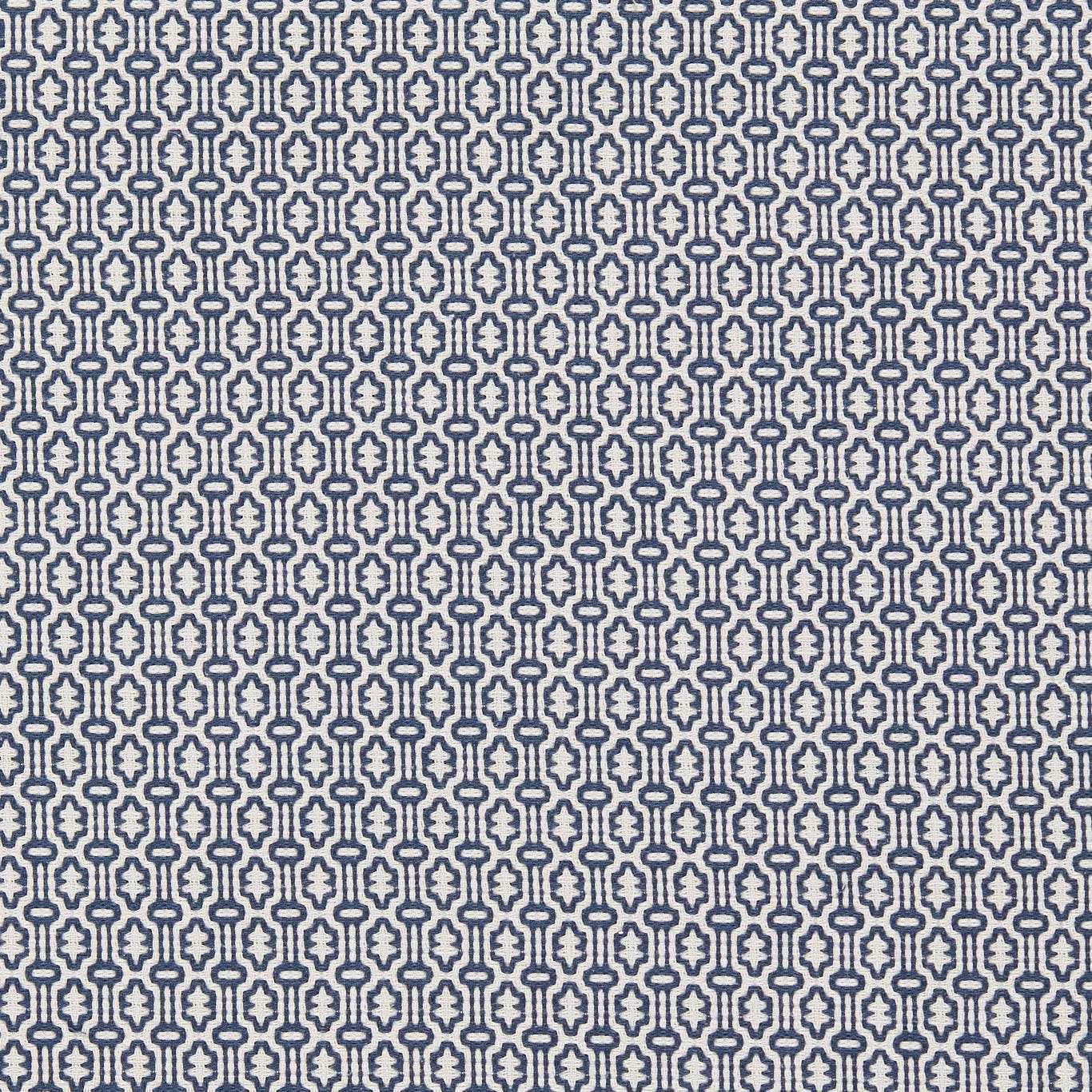 Close-up of small indigo geometric weave on a pale ground