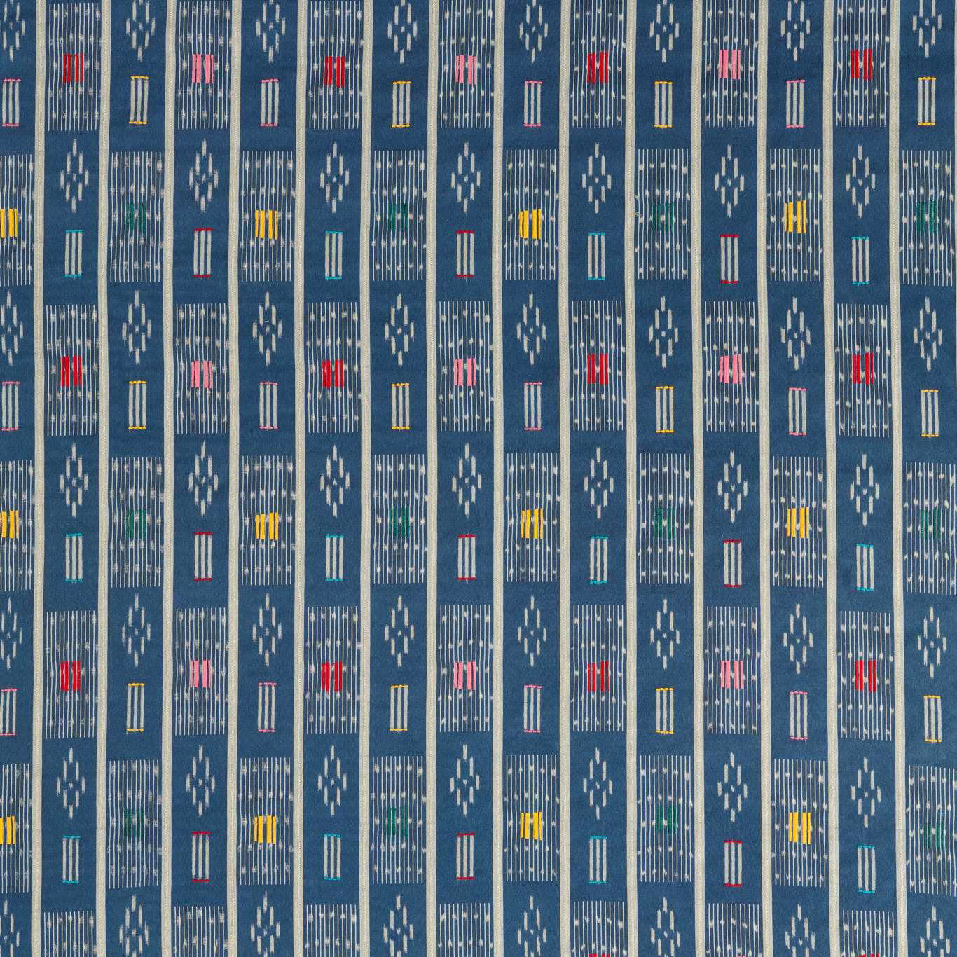 Blue woven fabric with narrow stripe columns and small multicoloured geometric motifs