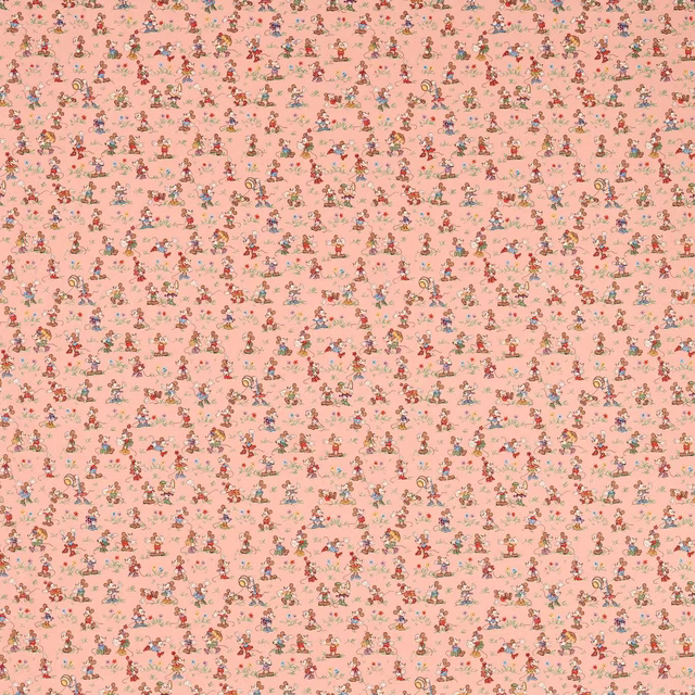Blush pink fabric scattered with tiny multicoloured Mickey and Minnie motifs