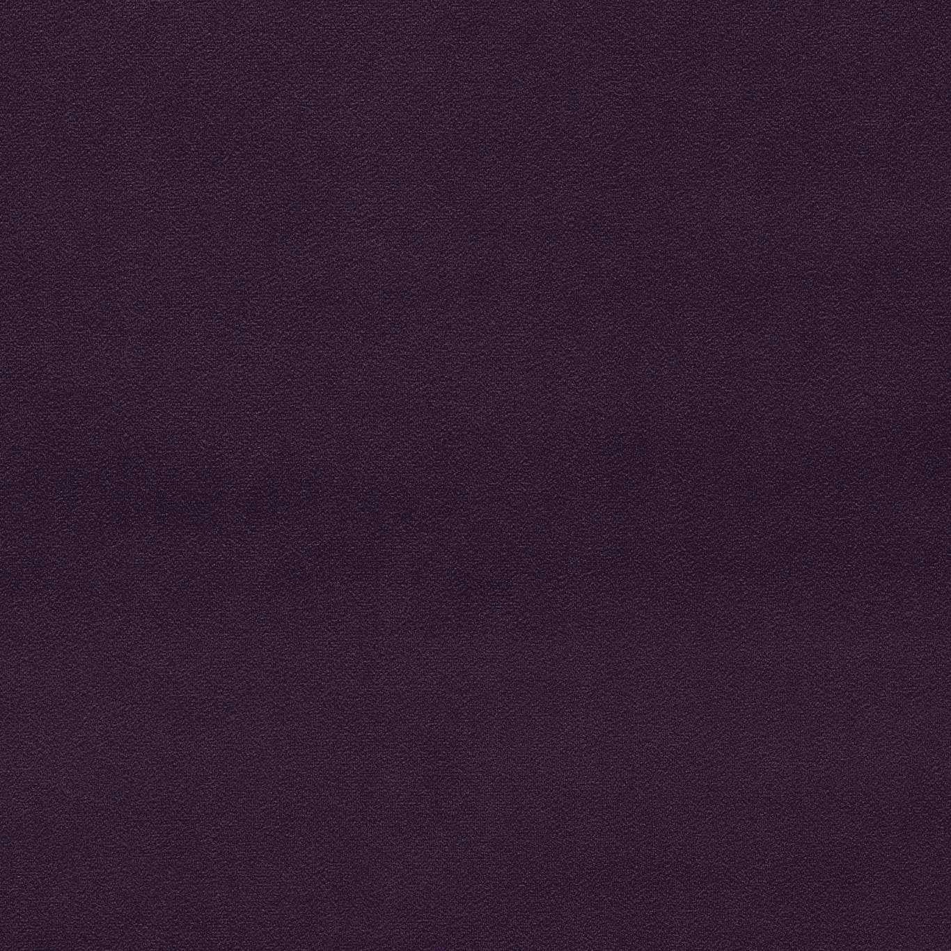 Close-up of plain deep aubergine velvet with a soft, dense pile