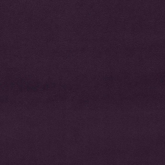 Close-up of plain deep aubergine velvet with a soft, dense pile
