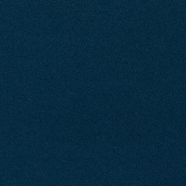Close-up of deep petrol blue velvet with a smooth, even pile