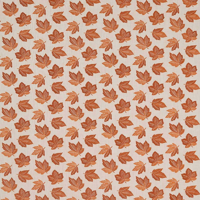 Repeating russet and orange leaf pattern on a pale textured fabric ground