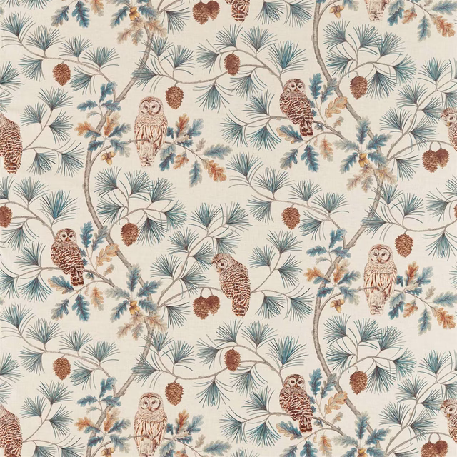 Cream fabric printed with teal pine sprays, owls and brown pinecones