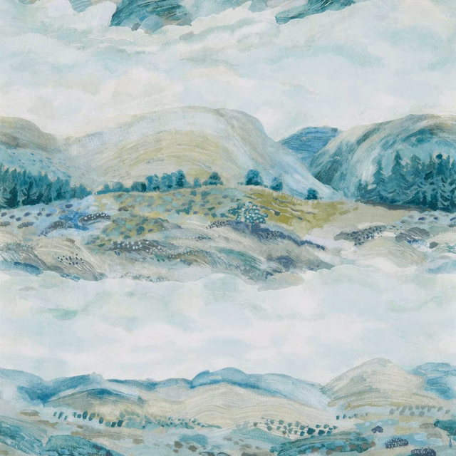 Misty blue-green mountain landscape with pale clouds, distant trees and layered hills