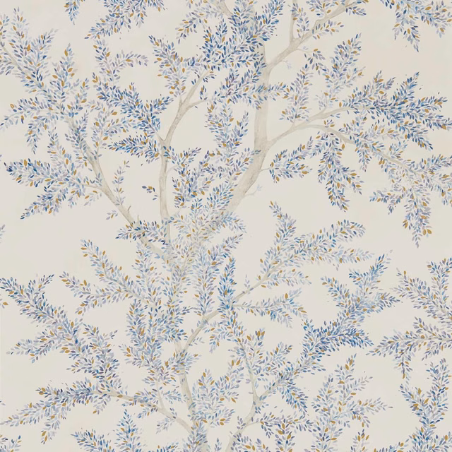 Cream wallpaper with branching tree, cobalt-blue leaves and soft ochre flecks