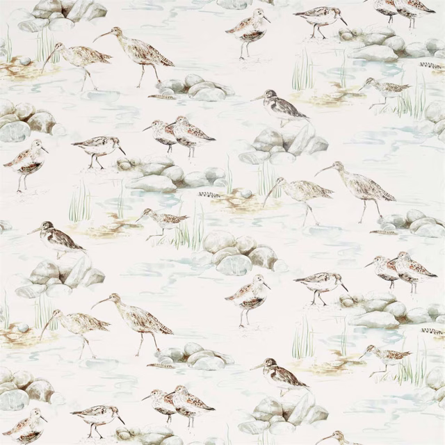 Pale ivory bird-pattern fabric with grey-blue water, rocks and reeds