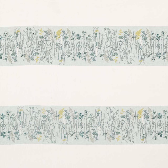 Misty blue-green botanical border fabric with pale ground and yellow flower accents
