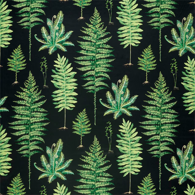 Dark charcoal fabric with repeated bright green fern fronds and botanical leaf motifs