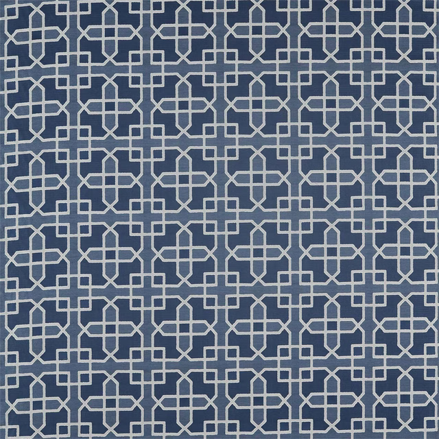 Blue geometric woven fabric with pale lattice pattern on an indigo ground