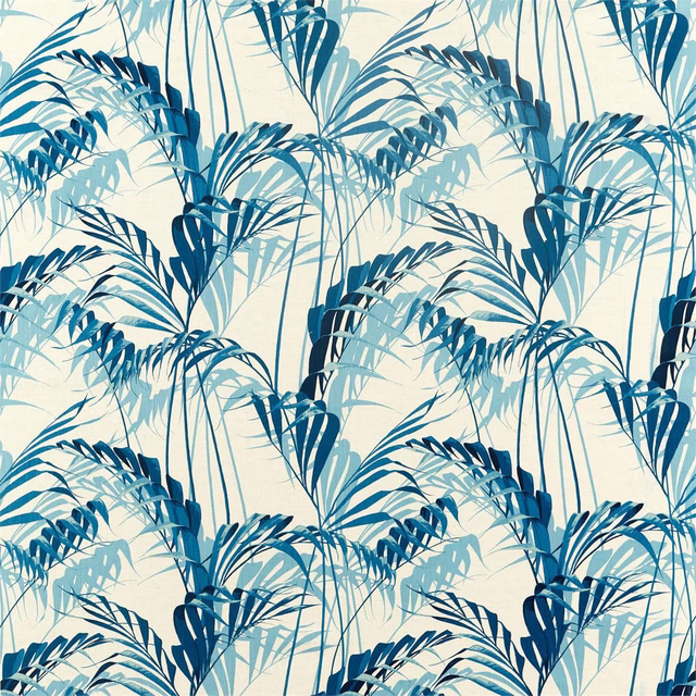 Blue palm leaf fabric with layered fronds on an ivory ground