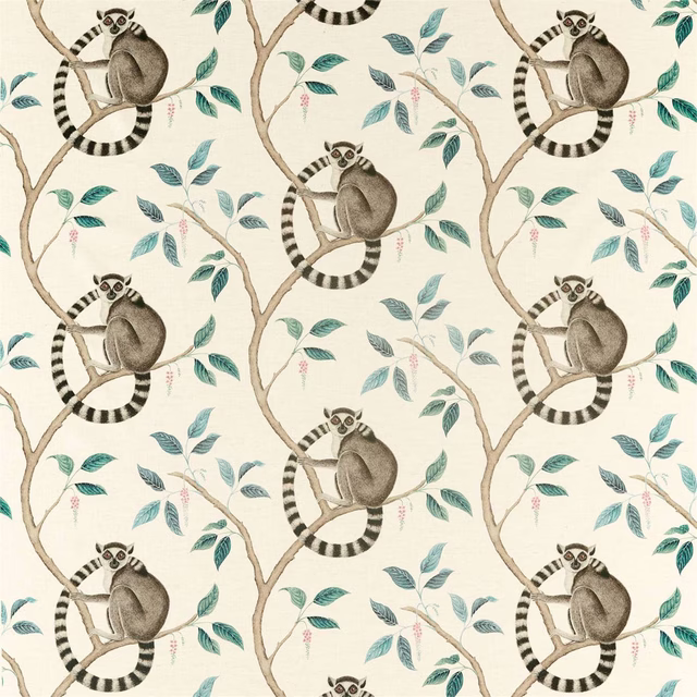 Cream fabric printed with ring-tailed lemurs, branches, and teal leaves
