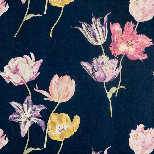 Painterly pink, lilac, ivory and yellow tulips scattered across an ink-blue ground