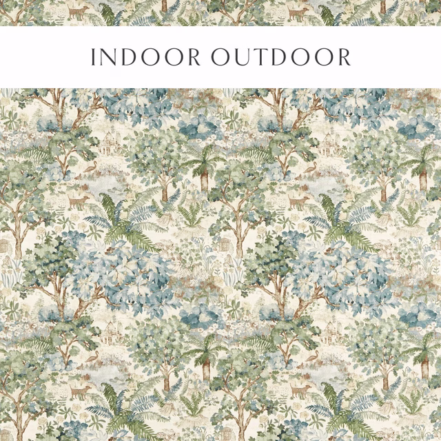 Painterly woodland fabric with soft fern green trees and pale blue foliage