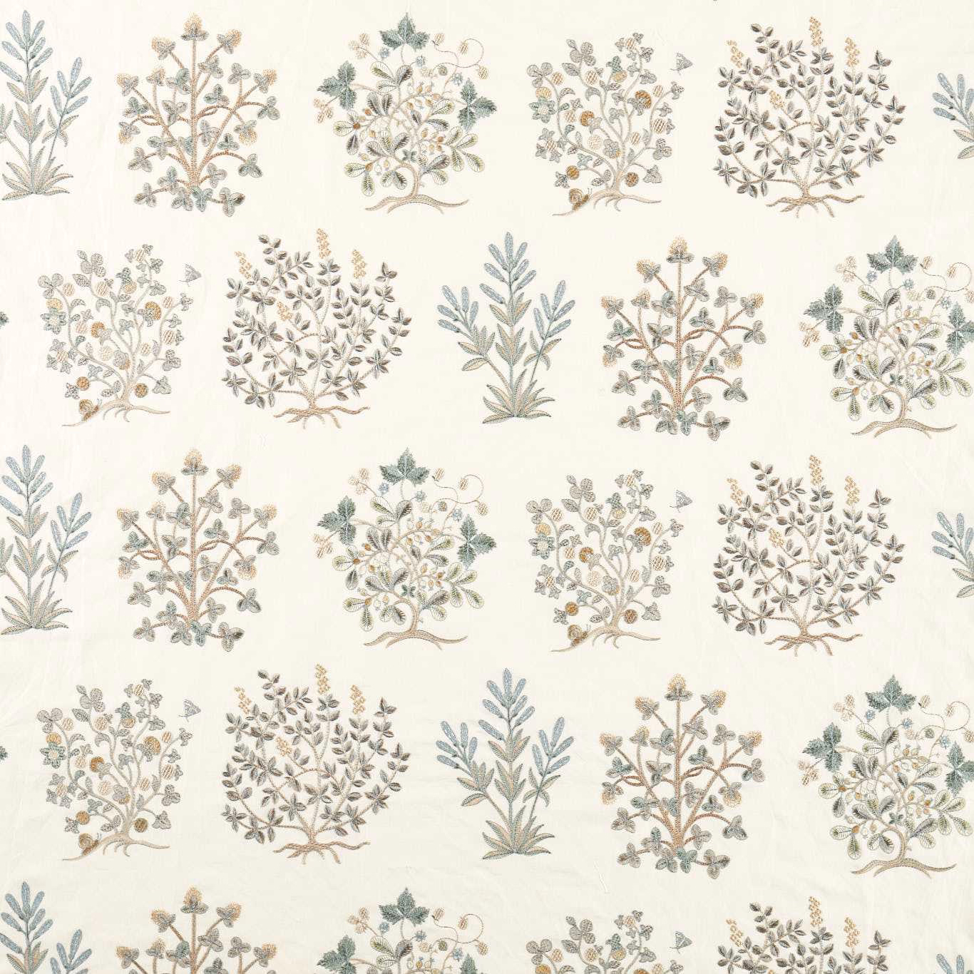 Cream botanical fabric with mineral blue and sage tree motifs
