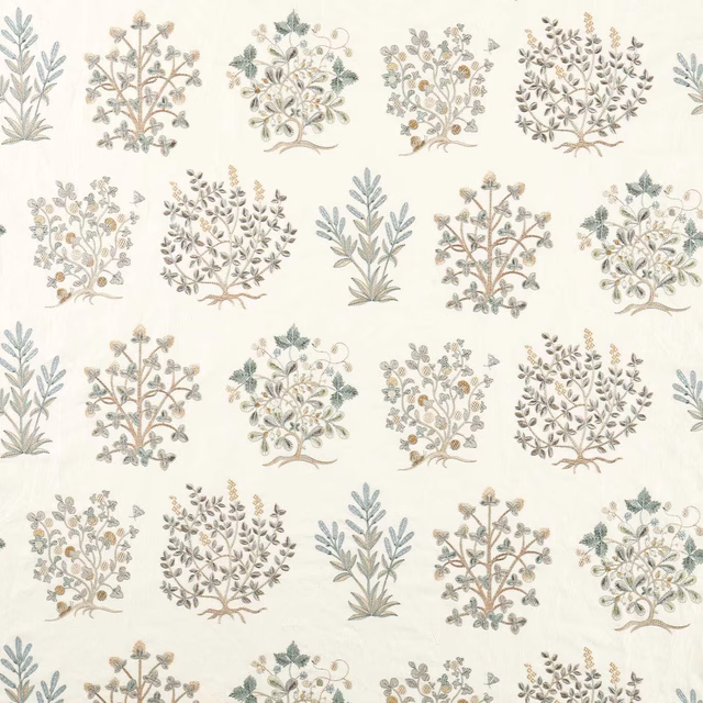 Cream botanical fabric with mineral blue and sage tree motifs