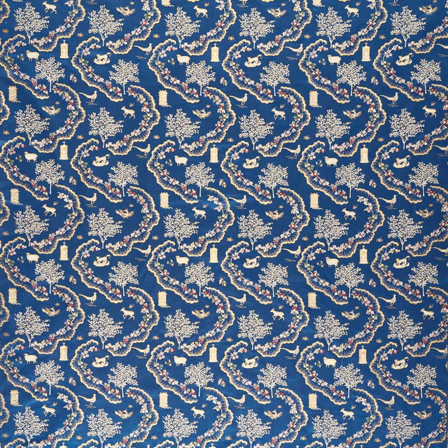 Blue brocade fabric with cream floral, animal and garden motifs