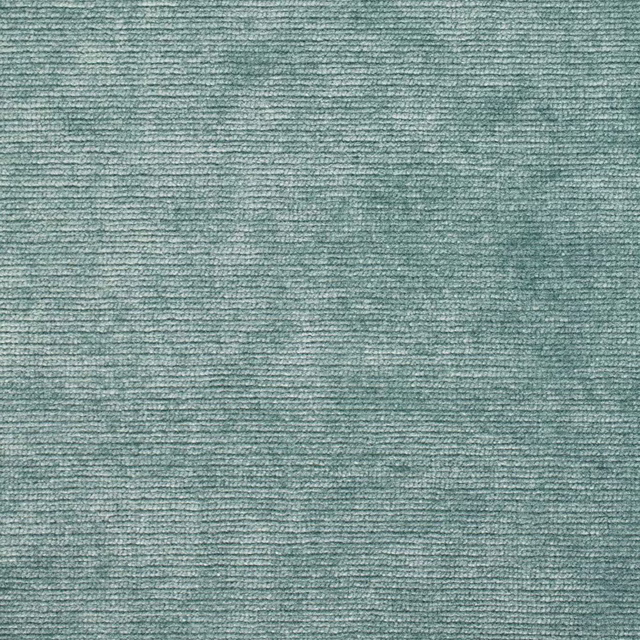 Close-up of celadon green velvet with a soft, ribbed pile texture