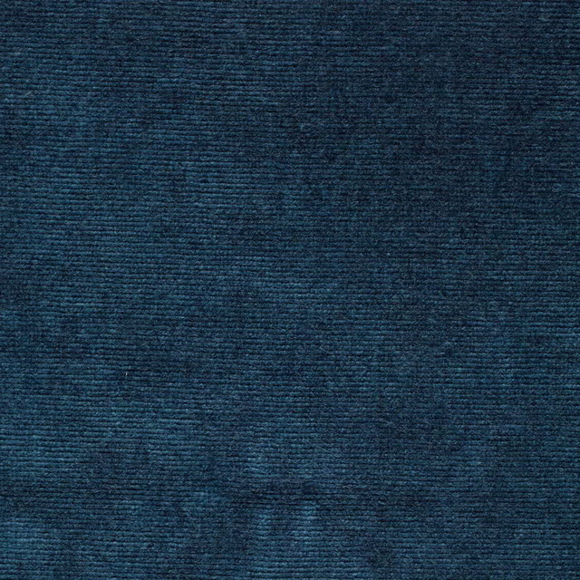 Close-up of deep marine teal velvet with a dense, ribbed pile texture