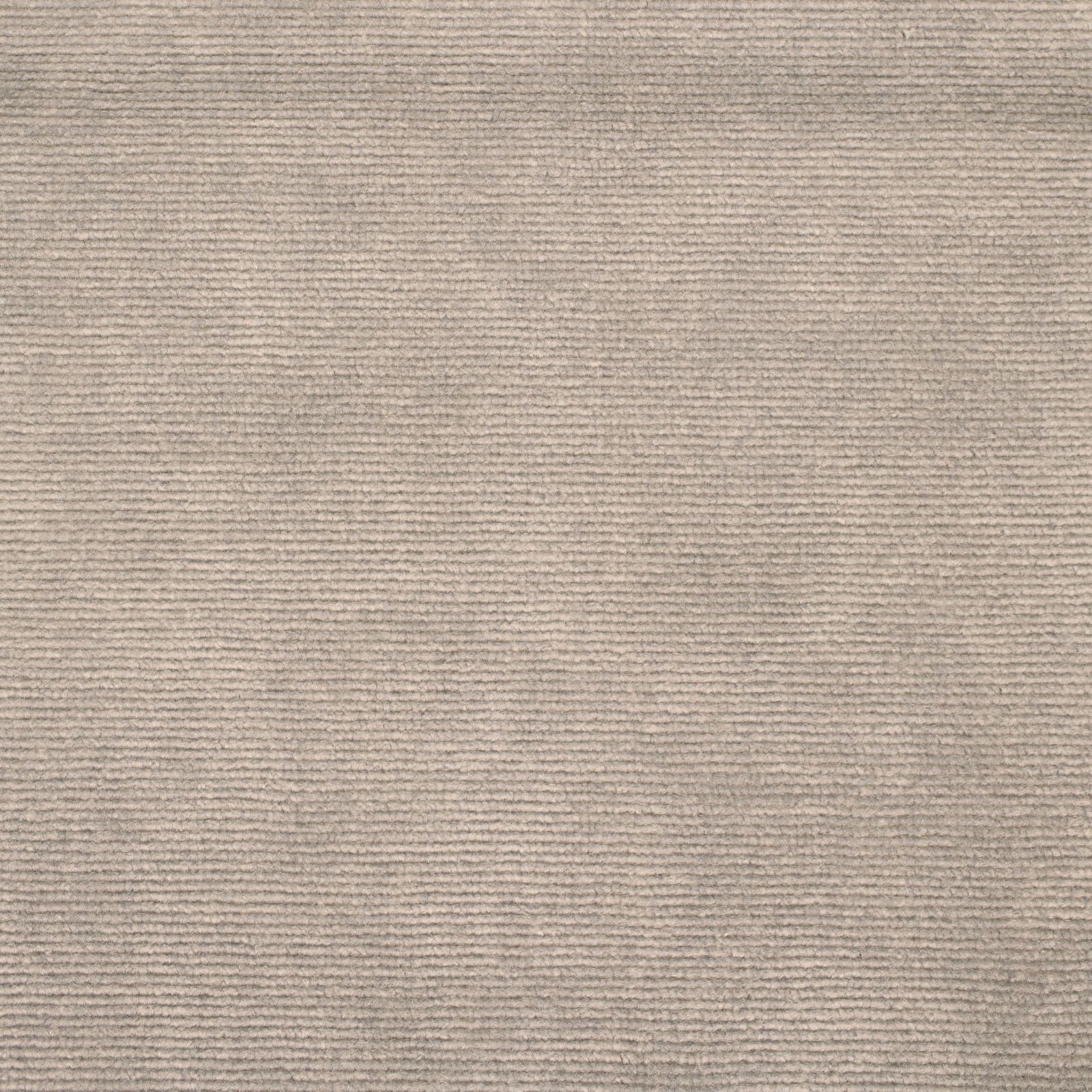 Close-up of warm putty beige velvet with fine horizontal pile texture