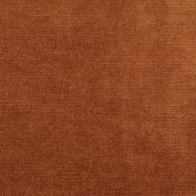 Close-up of warm burnt terracotta velvet with a dense, finely woven pile