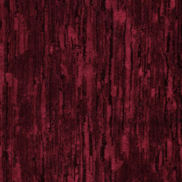 Deep ruby velvet swatch with dark vertical striations and plush pile