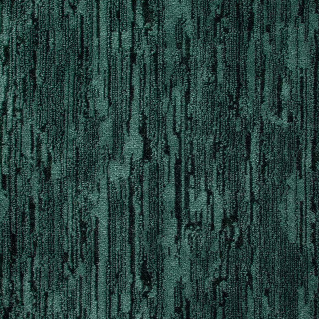 Dark teal velvet swatch with vertical striated texture and mottled pile