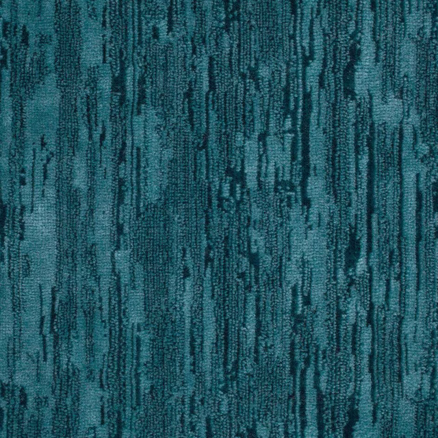 Close-up of deep turquoise velvet with dark abstract vertical streaks