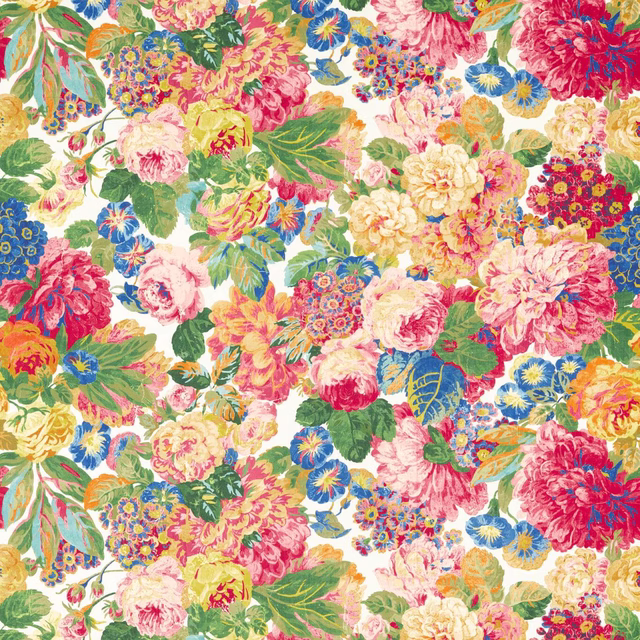 Large-scale floral print with cerise, pink, blue and green blooms on white ground