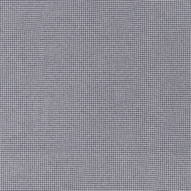 Close-up of muted indigo and stone micro-check woven fabric